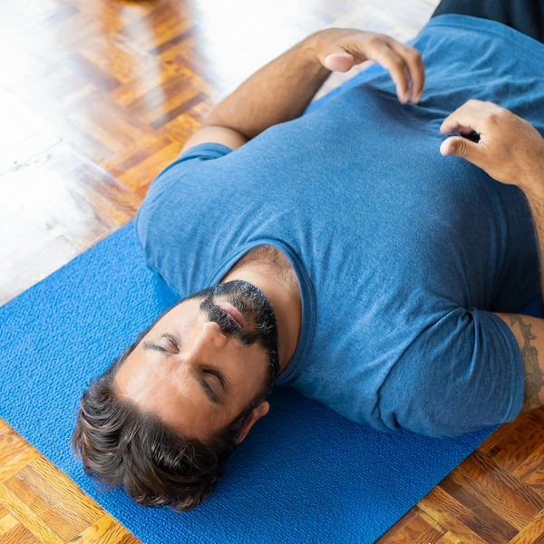 A person in a state of deep concentration during a physical exercise.